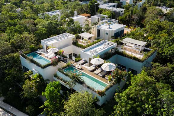 Contemporary 8BR Estate in La Privada | Dual Villas, Private Pools & Beach Access - Image 1