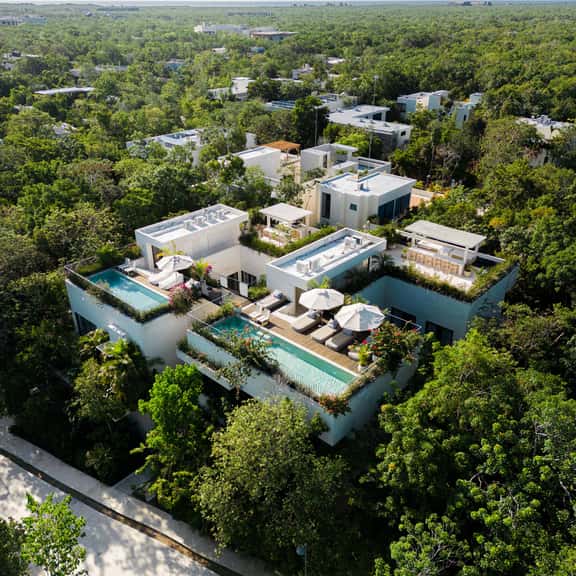 Contemporary 8BR Estate in La Privada | Dual Villas, Private Pools & Beach Access - Image 1